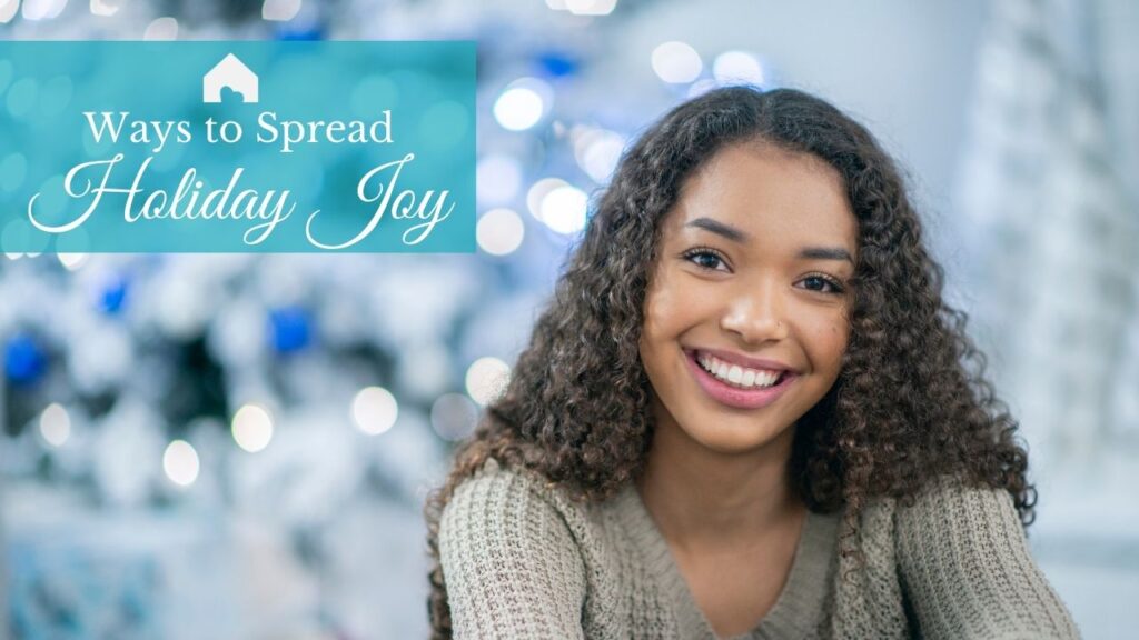 Girl smiling at the camera during the holidays. Words stating "Ways to spread holiday joy"