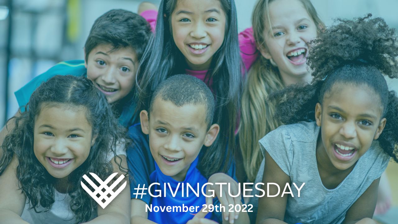 group of kids smiling at the camera with the words giving Tuesday, November 29th, 2022.
