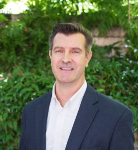 Smiling man in blue suit