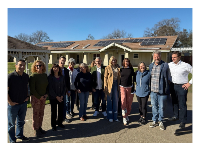 Group of 11 Board members standing outside